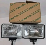 Genine Komatsu Headlamps 24VOLT B155090 71209. Fixed Price $45.00.